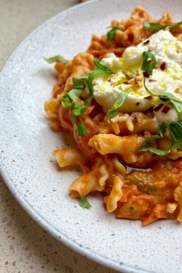 20 minute cherry tomato burrata pasta with fresh basil, burrata, and crushed red pepper flakes