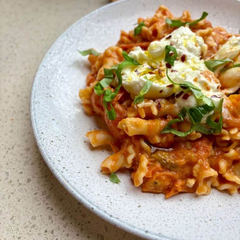 20 minute cherry tomato burrata pasta with fresh basil, burrata, and crushed red pepper flakes