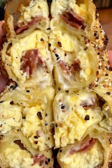 bacon egg and cheese rice paper spiral with melted cheese and sesame seeds