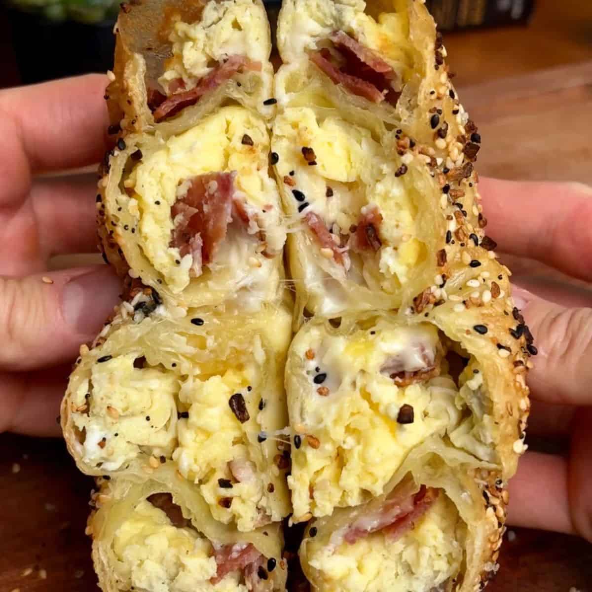 bacon egg and cheese rice paper spiral with melted cheese and sesame seeds