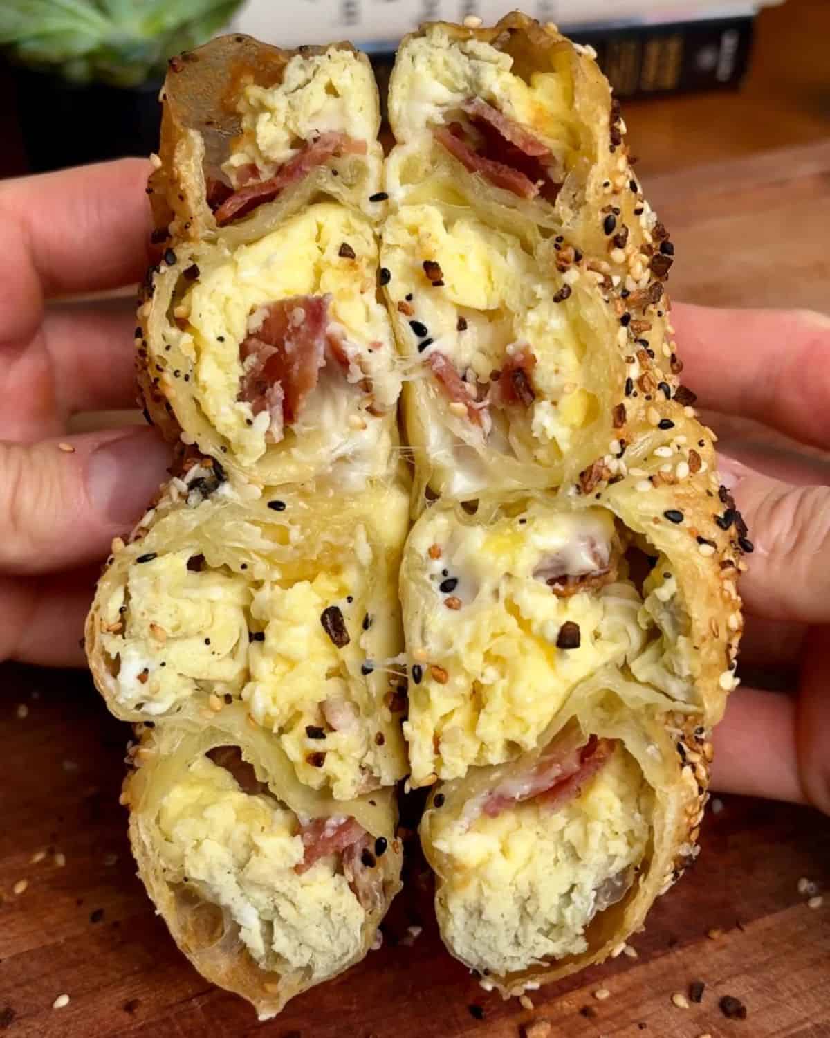 bacon egg and cheese rice paper sprial with crispy bacon, melted cheese and sesame seeds
