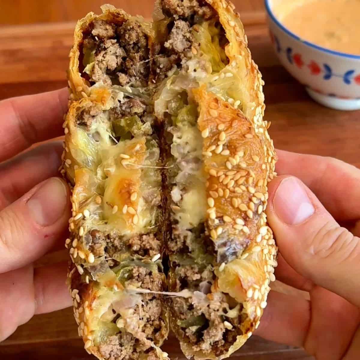 Big mac rice paper spiral with melted cheese and sesame seeds