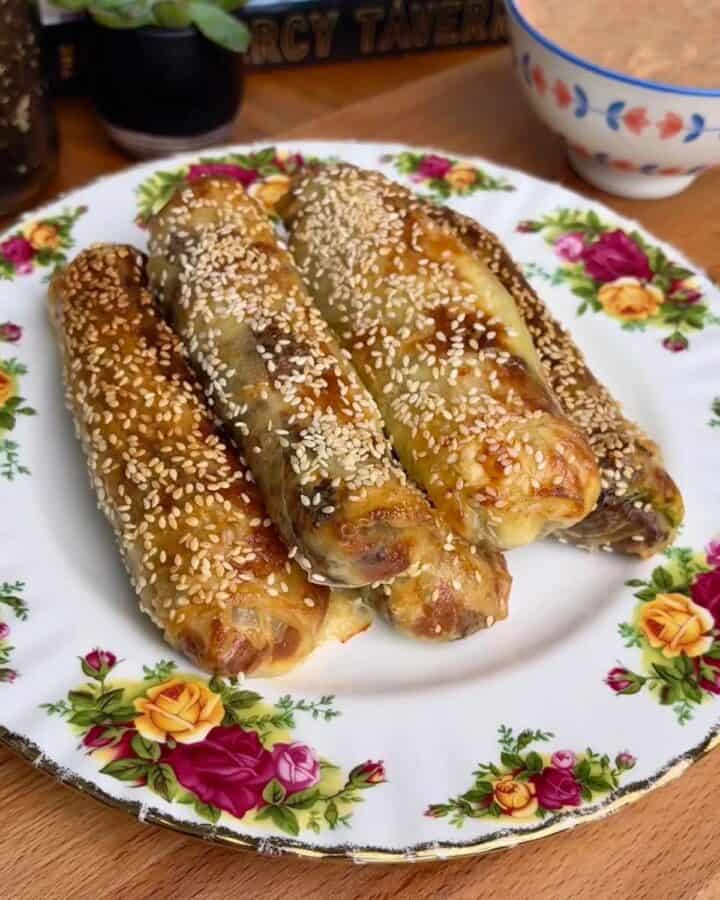 crispy cheeseburger rice paper spring rolls topped with sesame seeds
