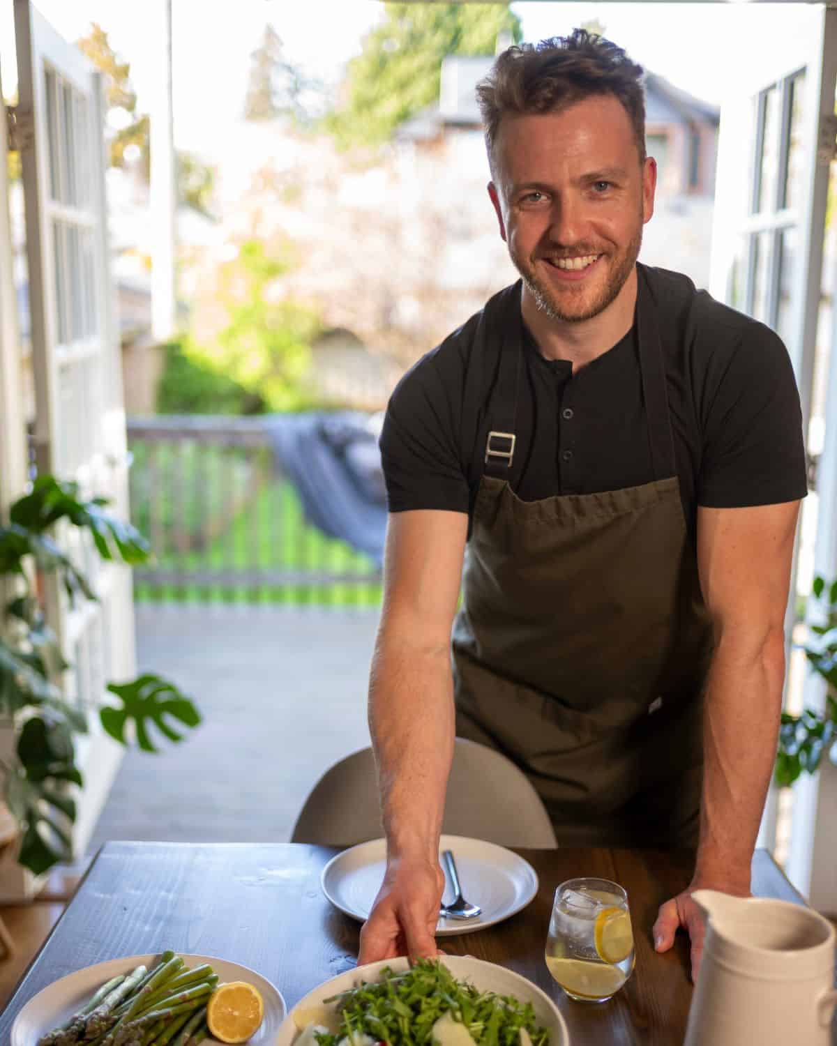 Chef Josh Gale plating fresh greens and asparagus
