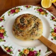 East meets west spanakopita rice paper spiral with white and black sesame seeds