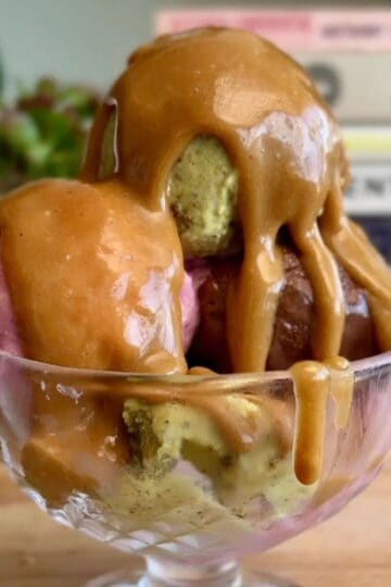 easy 2 ingredient caramel sauce drizzled on a tri-color sundae