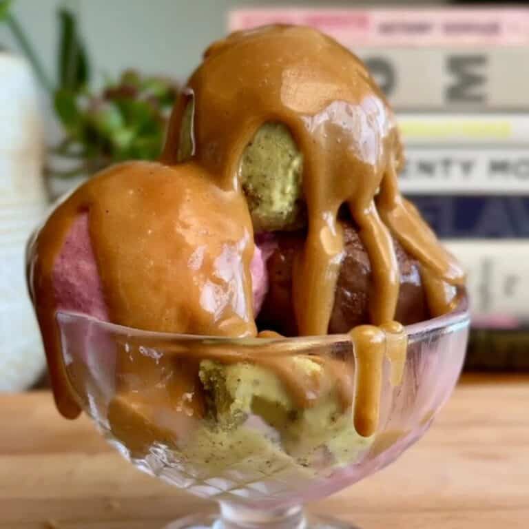 easy 2 ingredient caramel sauce drizzled on a tri-color sundae
