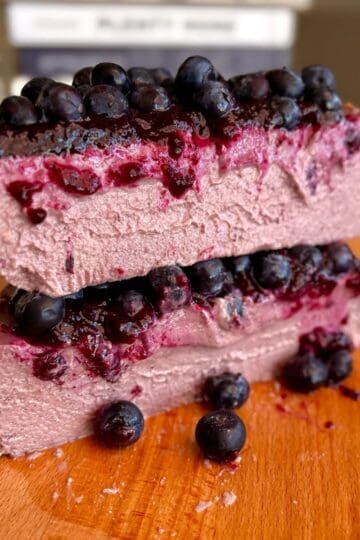 fudgy high protein blueberry cheesecake with jammy fresh blueberry topping