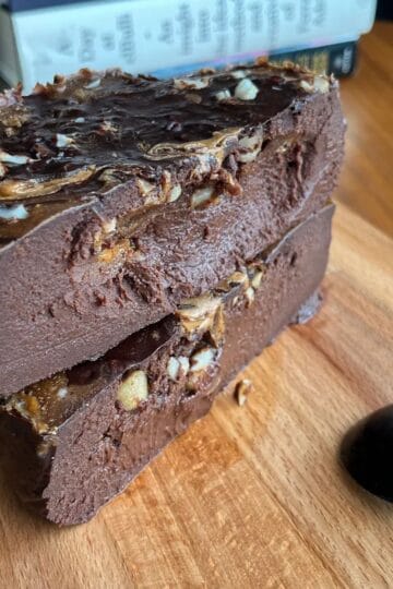 fudgy high protein ferrero rocher cheesecake topped with hazelnuts