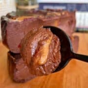 high protein chocolate banana pb&J cheesecake with glossy nut butter and jelly swirl