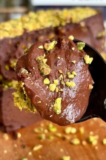 High protein chocolate pistachio dubai cheesecake with crushed pistachios