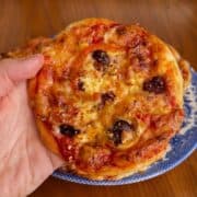 high protein mini greek pizza with olives and red pepper flakes