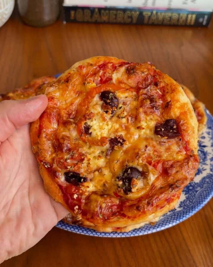high protein mini greek pizzas with olives, crushed red peppers and melted cheese