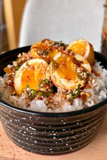 Korean marinated eggs and jasmine rice with sesame seeds and green onion