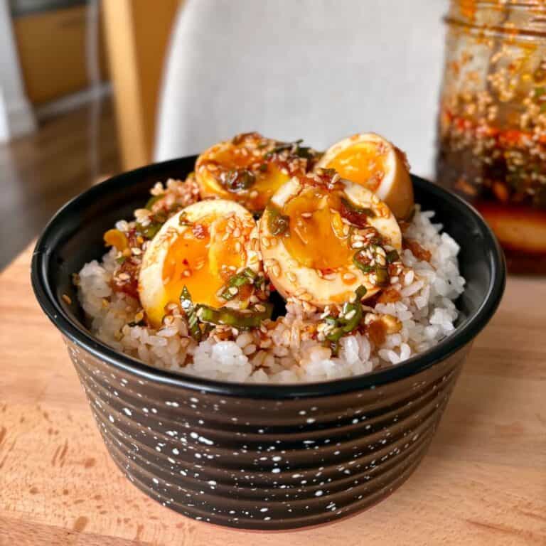 Korean marinated eggs and jasmine rice with sesame seeds and green onion