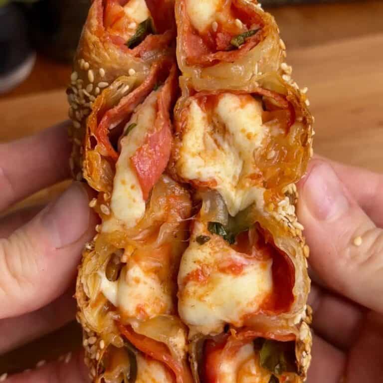 pepperoni pizza rice paper spiral with melted cheese and sesame seeds