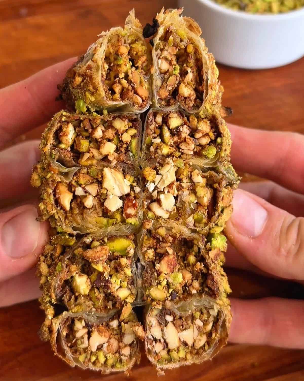 Pistachio baklava rice paper spiral with crushed pistachios and honey