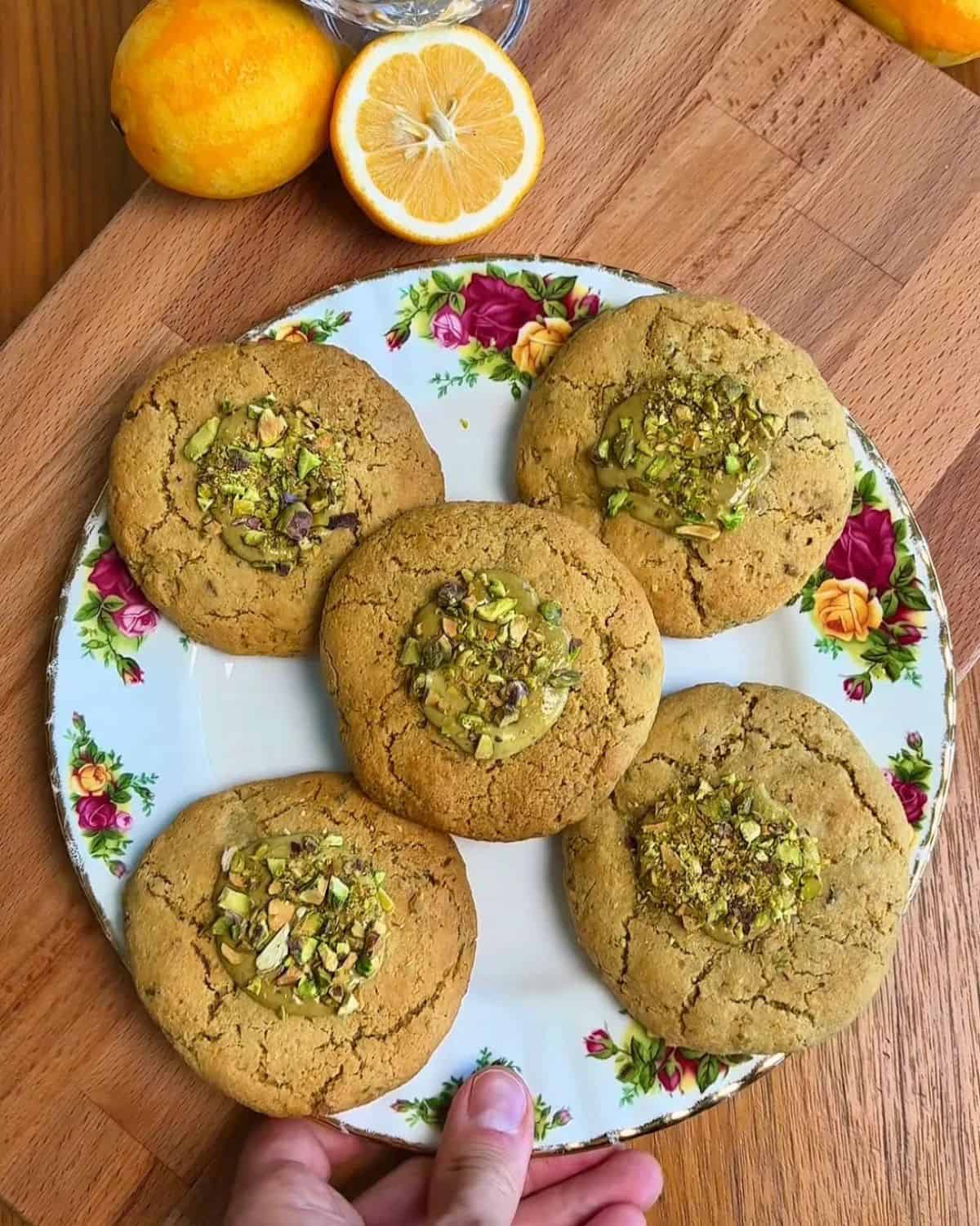 Pistachio meyer lemon cookies with pistachio frosting and crushed pistachios