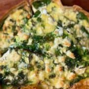 spanakopita tortilla quiche topped with feta and fresh rosemary