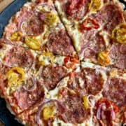 round, crispy hot honey chicken crust pizza topped with hot peppers, pepperoni, and red onion