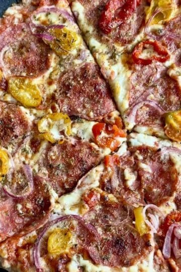 round, crispy hot honey chicken crust pizza topped with hot peppers, pepperoni, and red onion