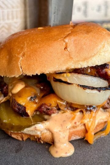 crispy, juicy, french onion style burger with melty cheddar cheese, punchy burger sauce and a toasted brioche bun