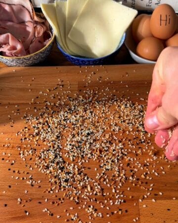 everything bagel seasoning on a cutting board, prepping for the making of a crispy rice paper croque madame