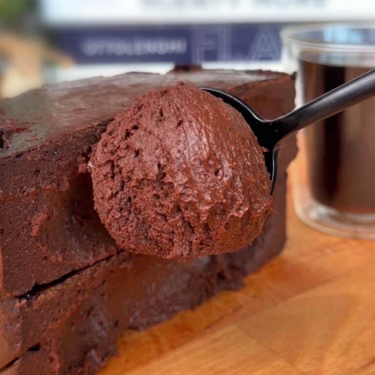 a spoonful of the creamy, chocolatey center of a high protein dark chocolate coffee cheesecake