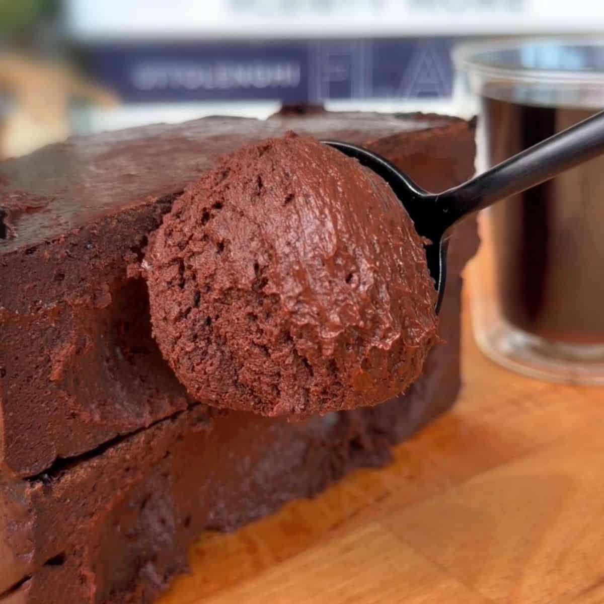 a spoonful of the creamy, chocolatey center of a high protein dark chocolate coffee cheesecake