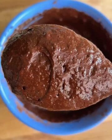 a spoonful of chocolate batter for high-protein microwave chocolate lava cake