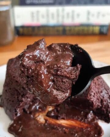 a spoonful of finished high-protein microwave chocolate lava cake fresh out of the microwave