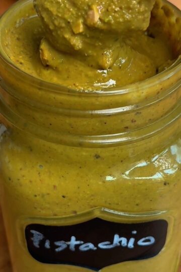 homemade pistachio butter in a mason jar labeled Pistachio