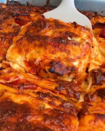 a crispy, cheesy slice of tortilla pull apart pizza bread on a spatula