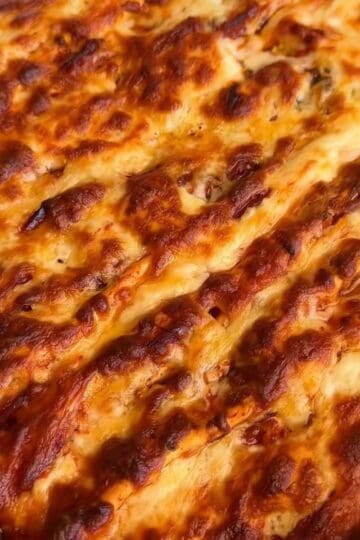 a crispy, cheesy, tortilla pull apart pizza bread fresh out of the oven