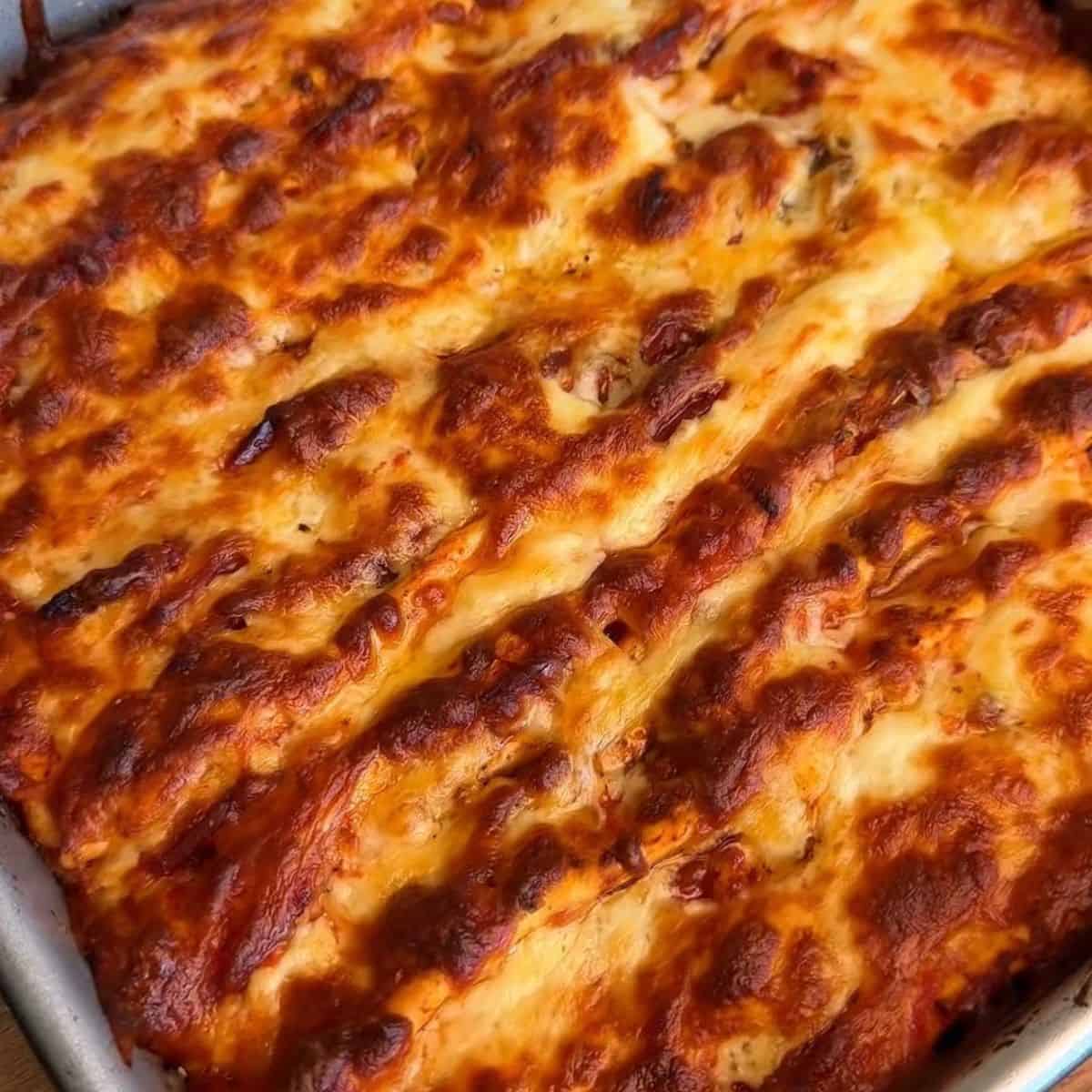 a crispy, cheesy, tortilla pull apart pizza bread fresh out of the oven