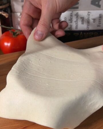 lining a small, greased bowl with puff pastry before layering in the cheeseburger wellington stack