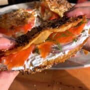 crispy baked rice paper sandwich, filled with cream cheese, red onion, capers, smoked salmon and dill