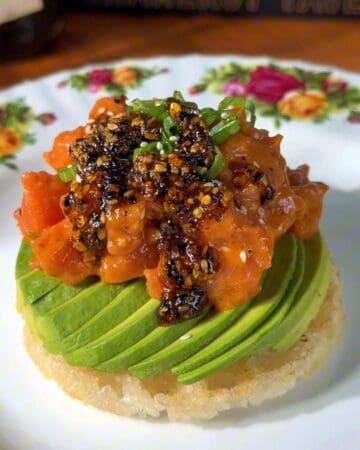 crispy rice waffle topped with avocado, salmon, green onion and chili oil