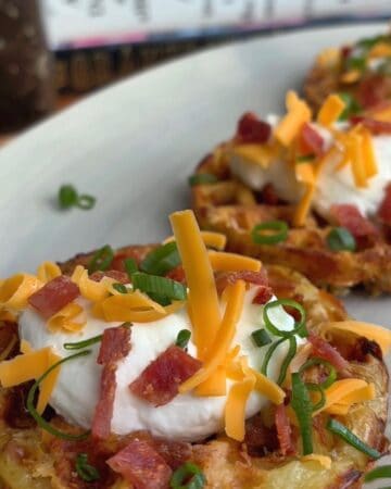 baked potato waffles topped with yogurt, cheese, green onion and bacon bits