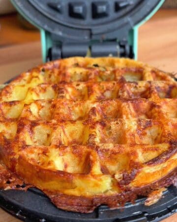 crispy brown, baked potato waffle in a waffle maker