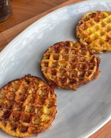 three waffles made from potatoes and cheese on a plate