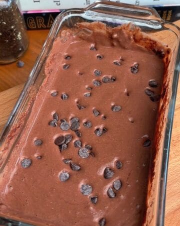 chocolate batter and chocolate chips in a baking dish for molten chocolate brownie lava cake