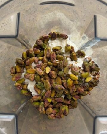 pistachios and cottage cheese in a blender for the making of 3 ingredient high protein pistachio ice cream