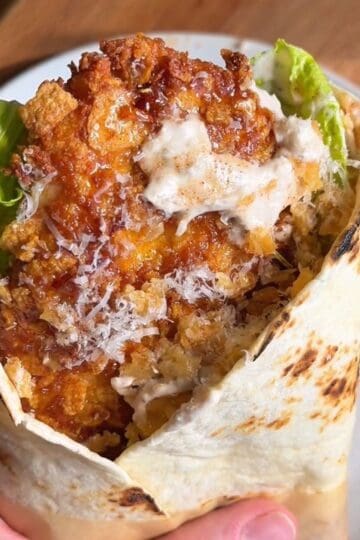 finished hot honey cornflake chicken caesar wrap, ready to be eaten