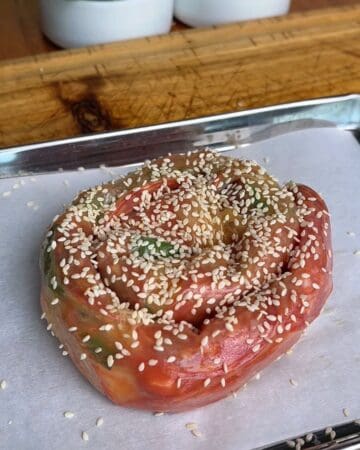 pepperoni pizza rice paper spiral on parchment paper ready to be baked or air fried