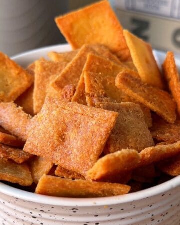 A bowl of crispy, crunchy homemade cheez-its, crispy and delicious.