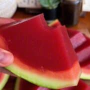 Perfectly set watermelon jello slice, served in the rind, to look just like watermelon