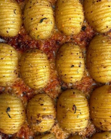 Close-up of roasted baby potatoes seasoned with herbs and spices.