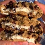 Chocolate chip cookie sandwich with creamy filling and melted chocolate chips, delicious dessert from The Chef Out West.